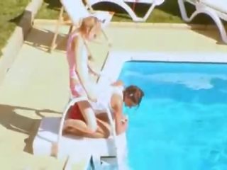 Three models secret loving by the pool